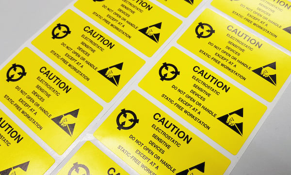 Standard caution label with text "Caution" for Electrostatic Sensitive Devices (ESD) in electronic industrial.