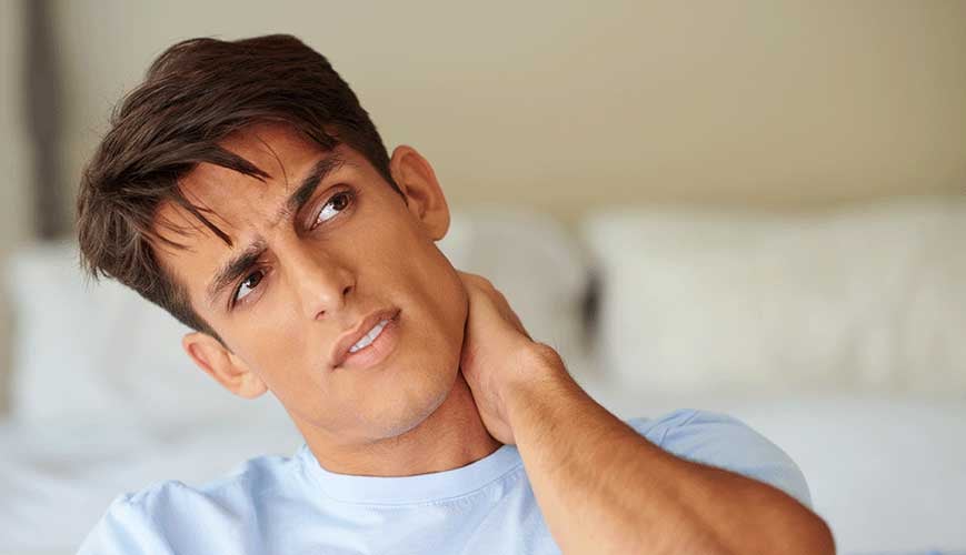 Young Man with Neck Pain from Whiplash