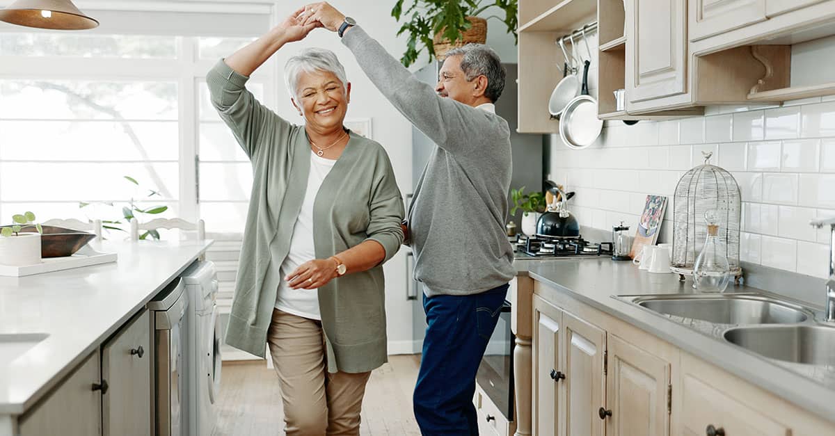 Senior couple dancing active aging with chiropractic care for seniors